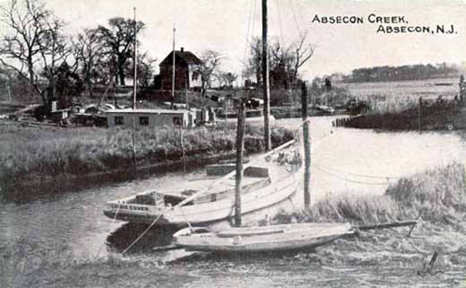 Absecon - view of Absecon Creek with boats and old house - c 1910